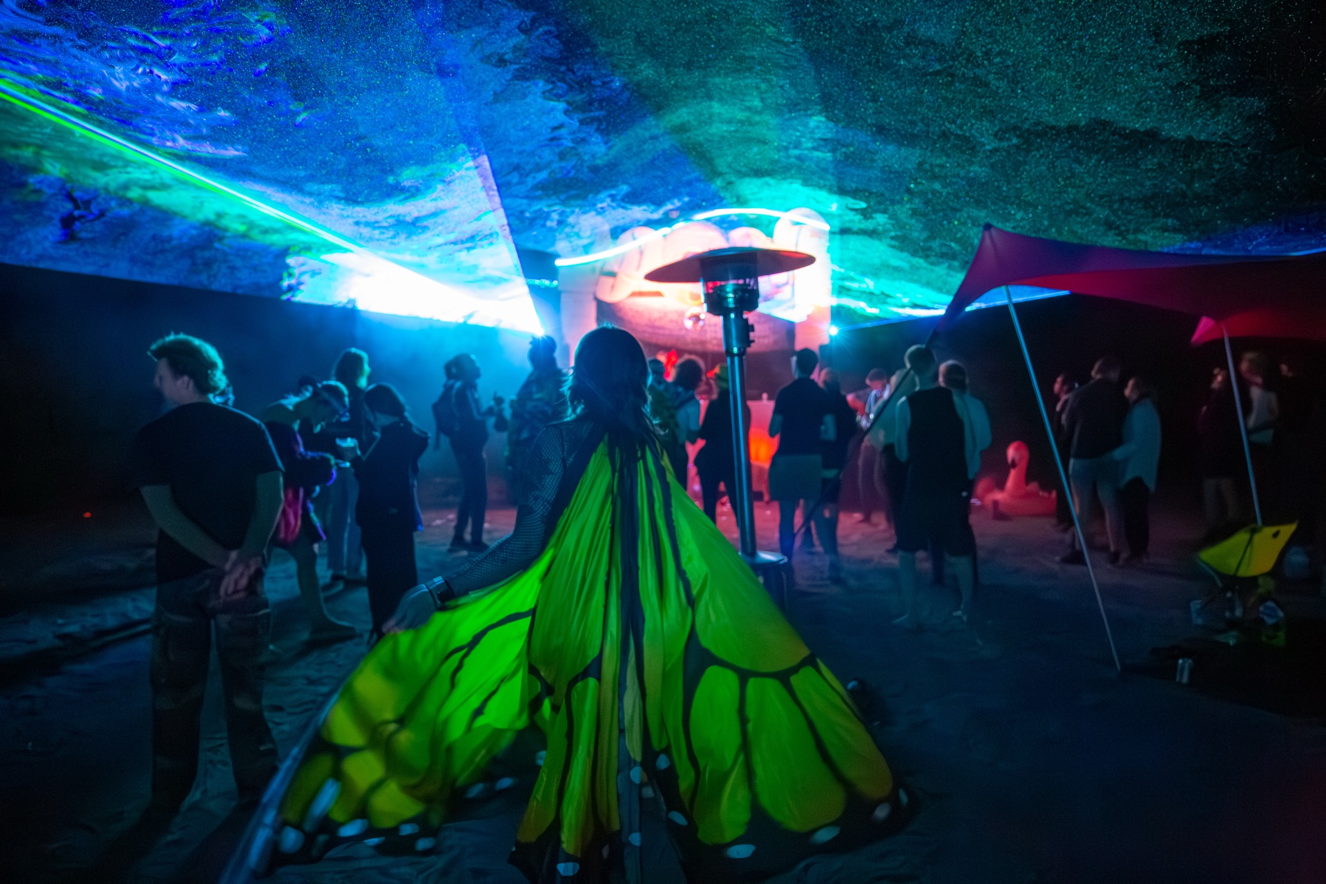 Campout 2025 late-night crowd beneath forest lights